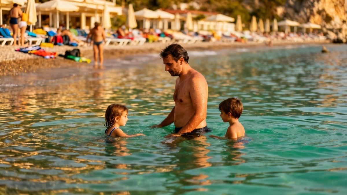 Shallow resort bay near Antalya with a parent and two children wading in knee-deep water